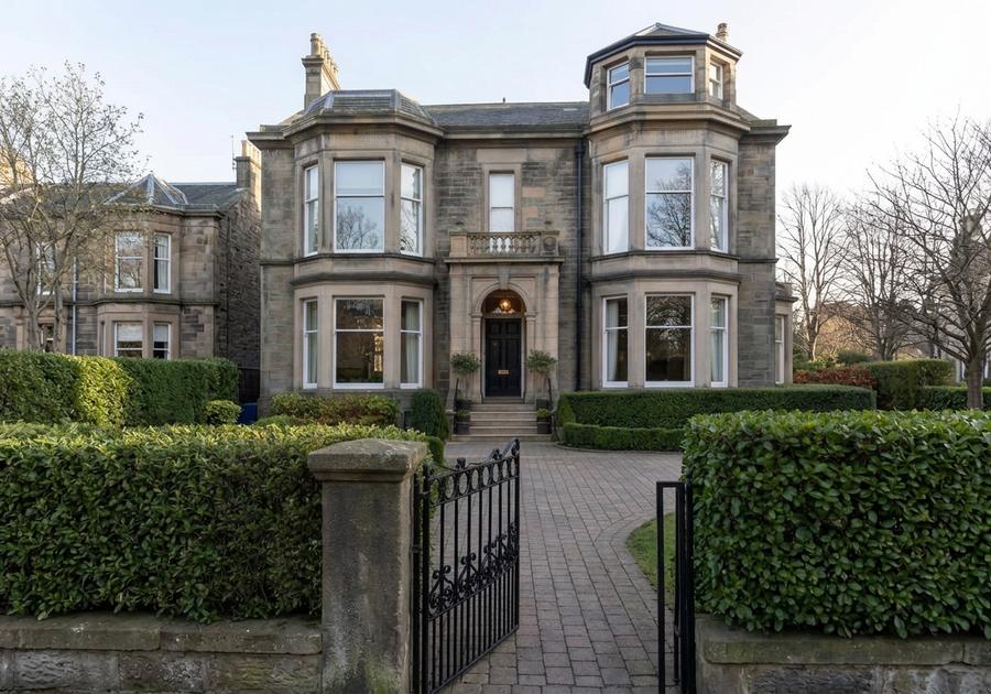 Victorian stone villa in Morningside, Edinburgh, with bay windows and a hedged front garden